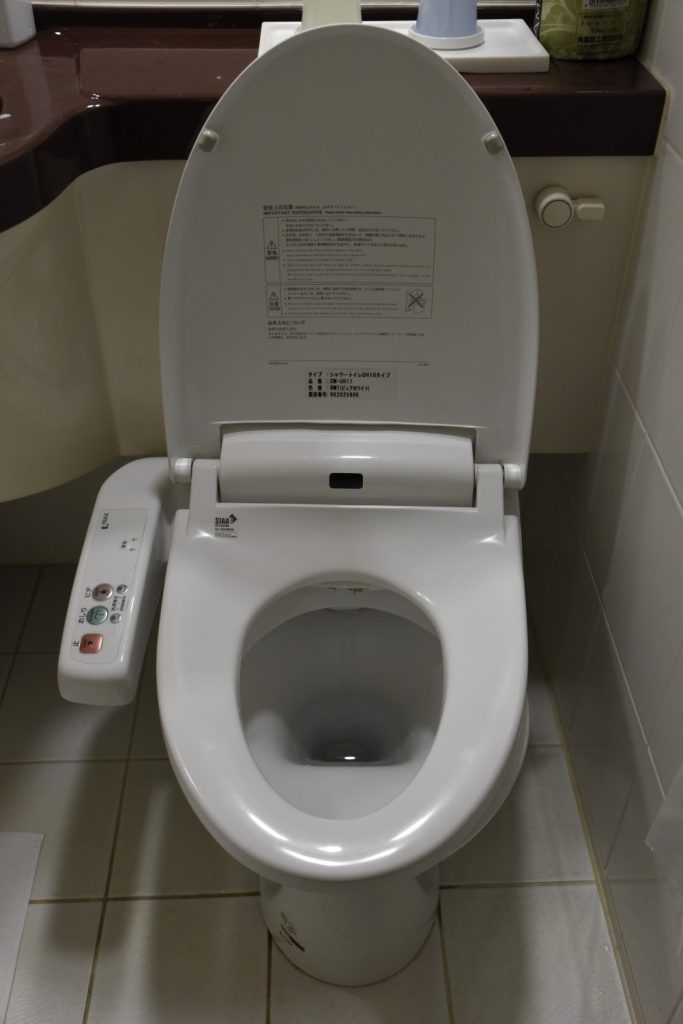 This Japanese high-tech toilet in my hotel room had a control panel on the left to use it as a bidet or to "shower" with warm water in lieu of wiping. The seat was pleasantly warmed. Note the detailed instructions on the seat lid. (Richard McGuire photo)