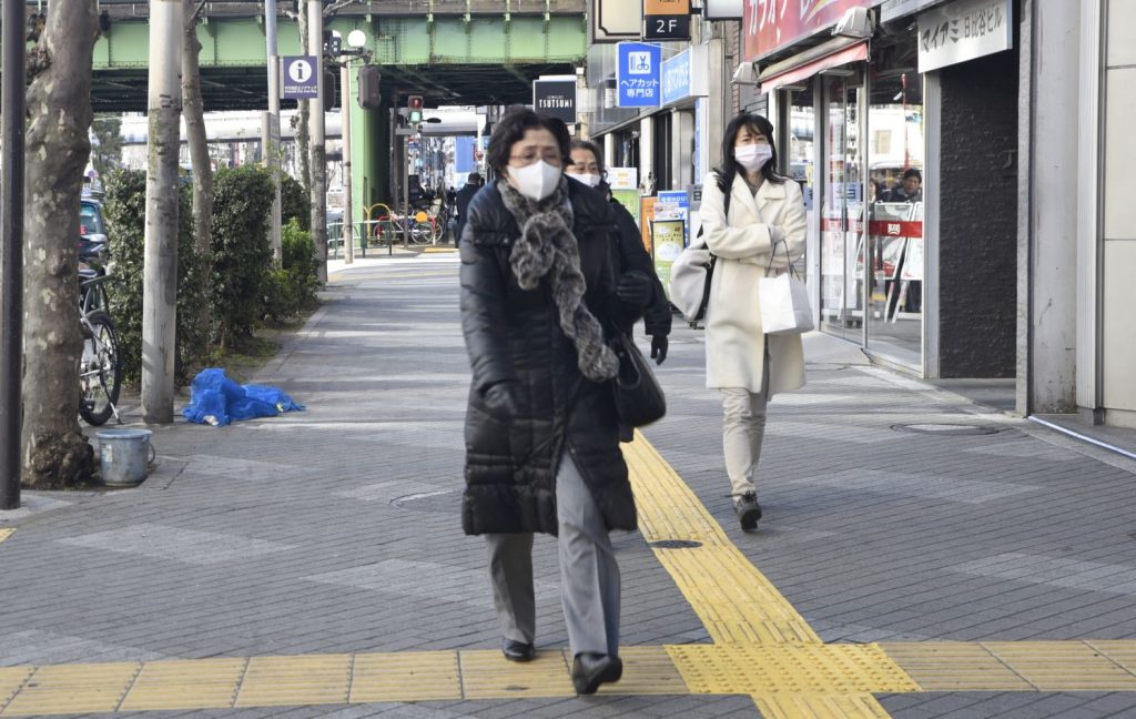In Tokyo, many Japanese walk around wearing surgical masks. Perhaps extreme germaphobia or perhaps a desire to be left alone and anonymous. (Richard McGuire photo)