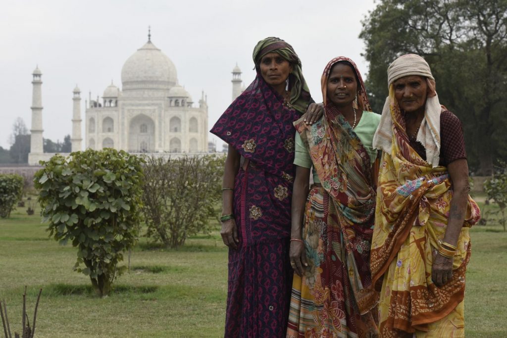 Some great views of the Taj Mahal can be seen from Mehtab Bagh, a garden across the Yamuna River from it. These women wanted to pose for rupees. (Richard McGuire photo)