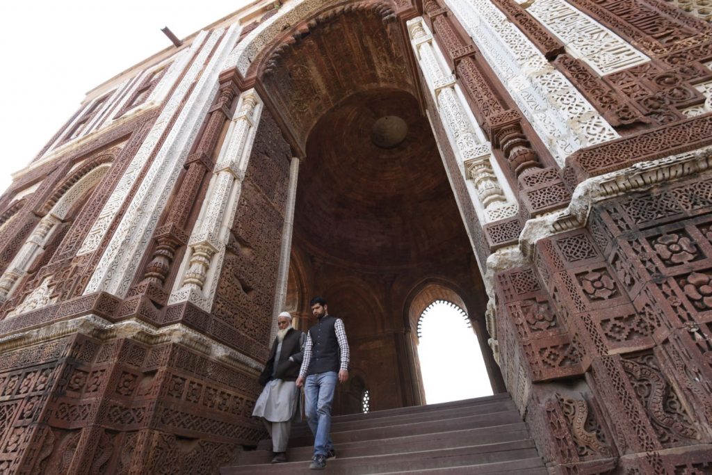 Two Muslim men descend the steps from one of the tombs at the Qutb Minar Complex in the south of New Delhi. (Richard McGuire photo)