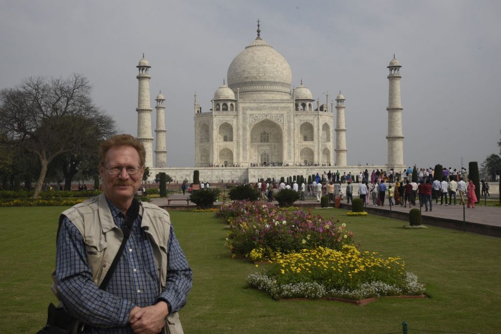 I asked an American tourist to take a few photos of me at the Taj Mahal with my camera.