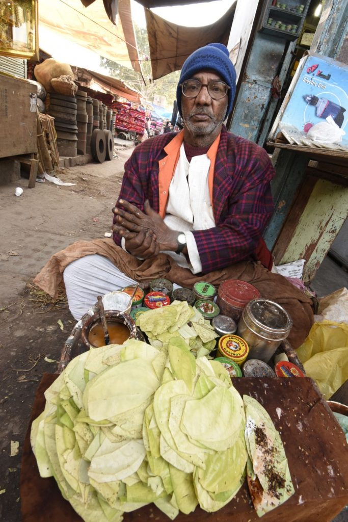 This man sells paan on a street in Old Delhi. Paan is a concoction wrapped in a leaf that people stick in their mouths for a mild buzz. When the spit the red juice onto the street and on buildings, it looks like fresh blood. (Richard McGuire photo)