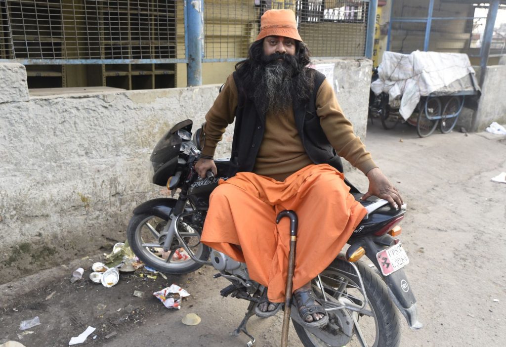 This sadhu or holy man was perched on a motorcycle when I photographed him. He said it wasn't his. Sadhus renounce worldly possessions. (Richard McGuire photo)