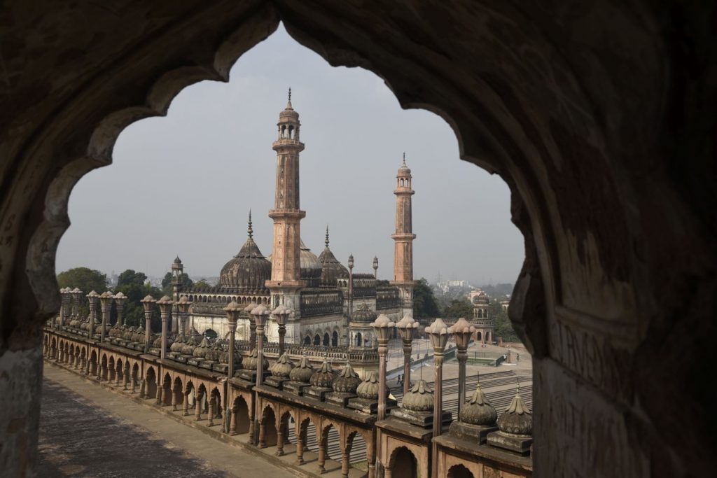 The Bara Imambara, a tomb complex in Lucknow, includes a mosque shown here through an arch on the main building. (Richard McGuire photo)