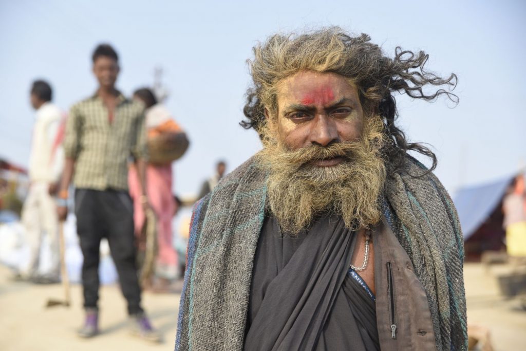 A sadhu or Indian holy man poses for a photo at Sangam, the confluence of the holy Ganges and Yamuna rivers at Allahabad. (Richard McGuire photo)