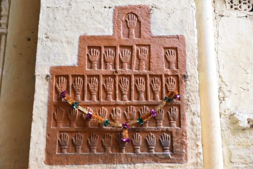 Widows of the maharajas were burned on their husbands' funeral pyres in a Hindu tradition called "sati." When they left the fortress for the last time, they left their hand prints. The last such case of sati for a maharaja's widows in Jodhpur was in the 1840s. (Richard McGuire photo)