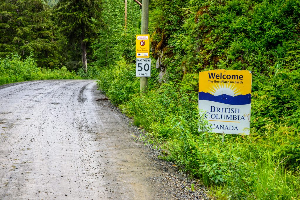 A sign welcoming you to B.C., a border marker and a long line cleared of vegetation every 10 years are the only indications you have crossed an international border north of Hyder, Alaska on the way to Salmon Glacier in British Columbia. (Richard McGuire photo)