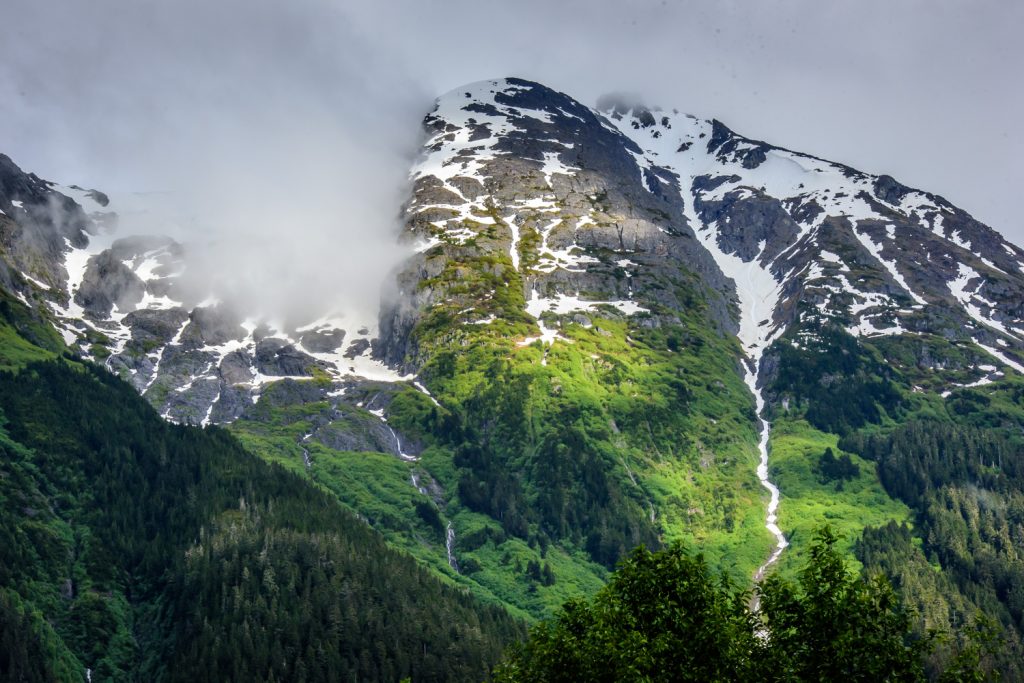 Late in the afternoon, sunlight broke through the clouds and rain lighting up the mountains above Stewart, B.C. (Richard McGuire photo)
