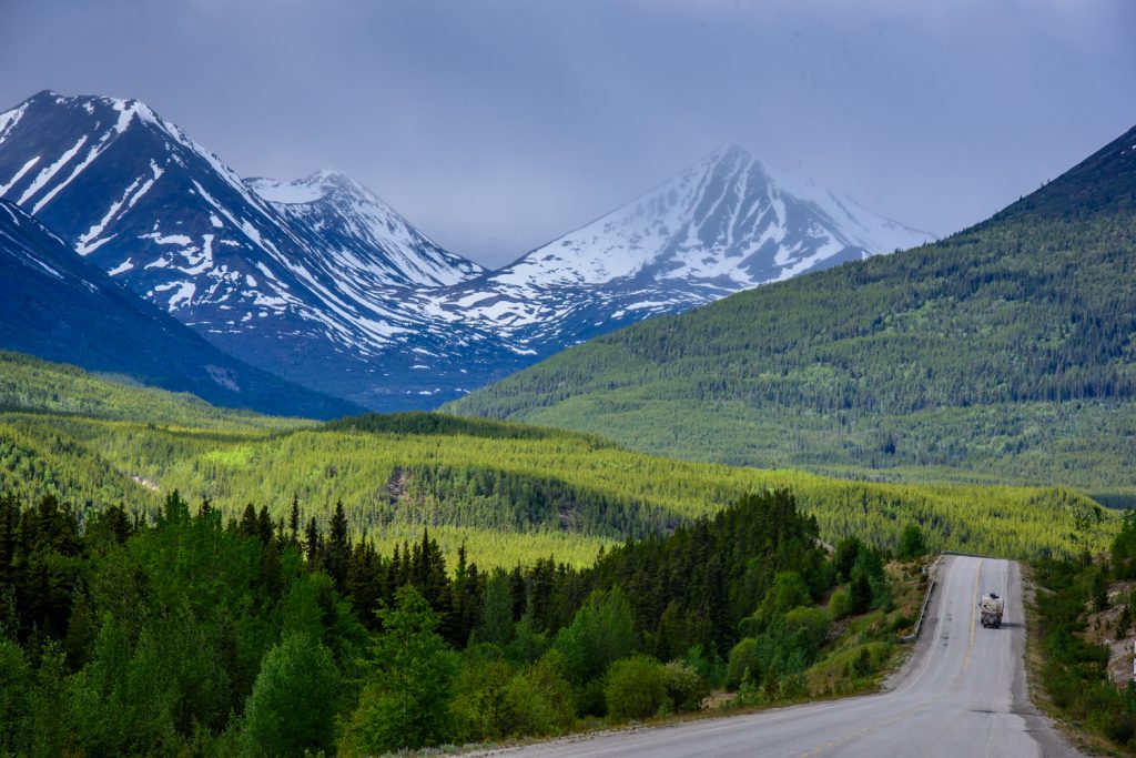 On the Alaska Highway the road stretches though miles of wilderness with snow covered mountains all around. (Richard McGuire photo)