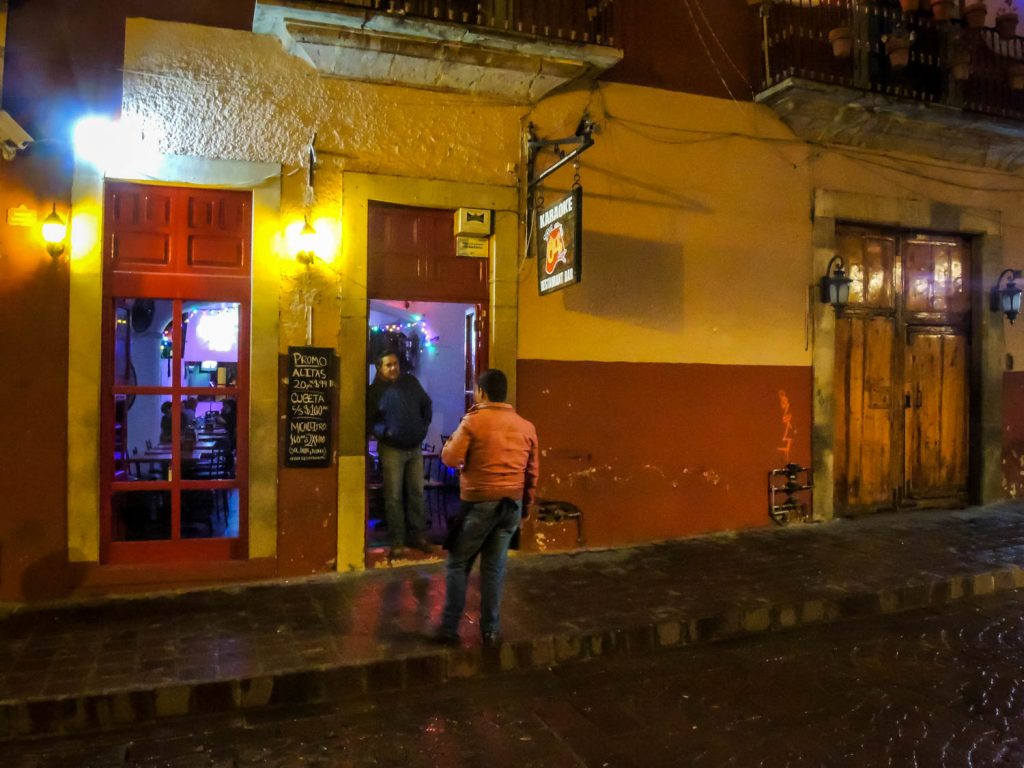 A couple of men chat outside a bar in the historic centre of Guanajuato. (Richard McGuire photo)