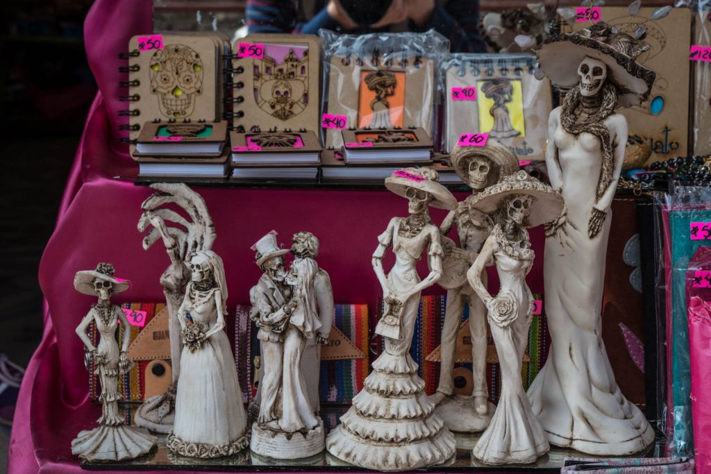 These figures of death, including an elegantly dressed Catrina, were being sold at a stall near Museo de las Momias. (Richard McGuire Photo)