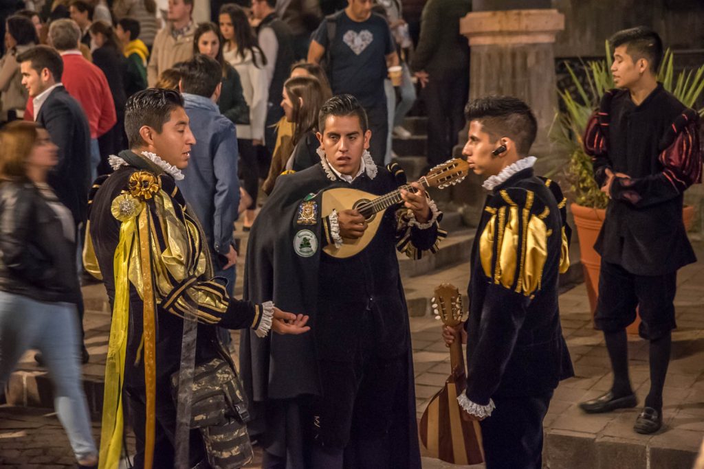 At night, students parade through central Guanajuato in costume and playing musical instruments. (Richard McGuire Photo)