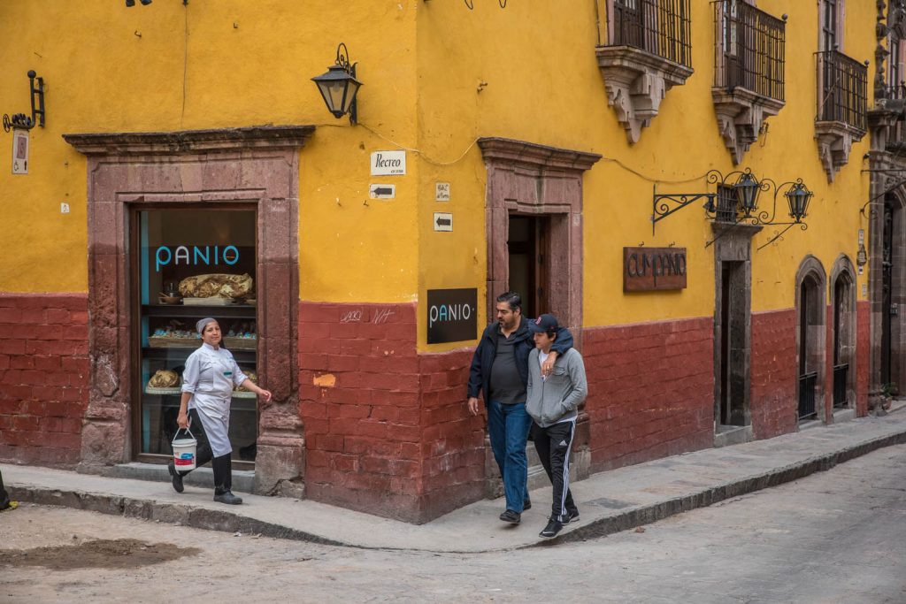 People are about to cross paths in front of a bakery in the historic centre of San Miguel de Allende. (Richard McGuire Photo)