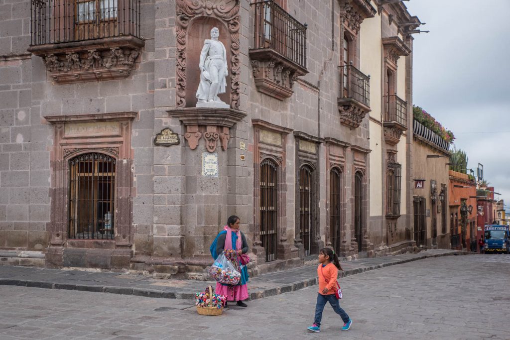 A little girl walks past a woman selling handmade dolls near the central plaza of San Miguel de Allende. (Richard McGuire Photo)
