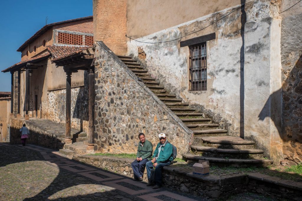 Two men sit at the bottom of a stone stairway at Casa de los Once Patios in Patzcuaro. (Richard McGuire photo)