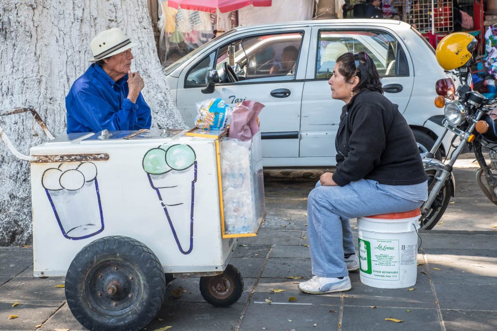 An ice cream vendor chats with a woman in Patzcuaro's Plaza Chica. (Richard McGuire photo)