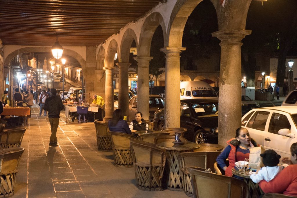 People stop at cafes and restaurants under the portales of buildings lining the main square in Patzcuaro. (Richard MvGuire Photo)