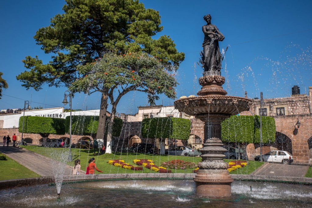 A fountain at Morelia's Plaza Villalogin is surrounded by a garden and a small park. (Richard McGuire Photo)